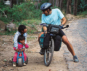 Bruce chats with kids on a bicycle