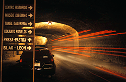 street sign and traffic in tunnel